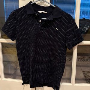 Boys navy blue polo.  Size large. Navy blue with white dots